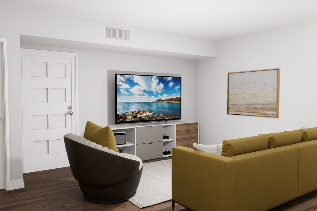 a living room with a couch and a television on the wall