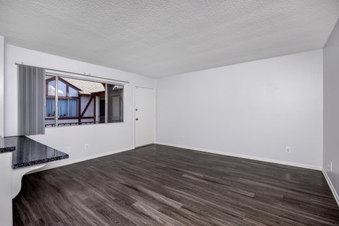 A room with a window and a counter.