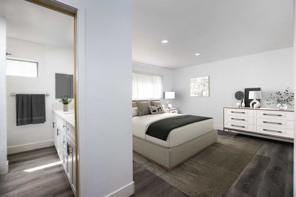 a bedroom with a bed and a mirror