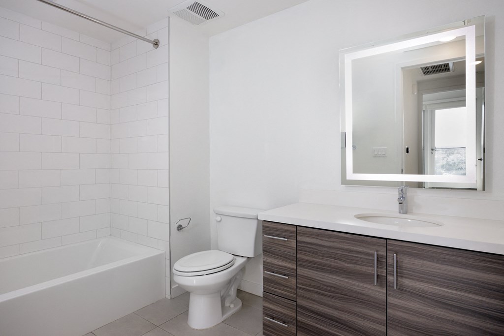 an empty bathroom with a toilet and a sink