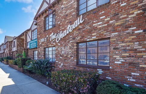 The building is made of bricks and has a sign that reads "The Chateau".