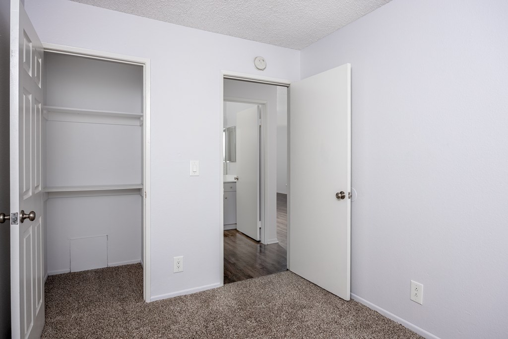 A white door is open to a hallway.