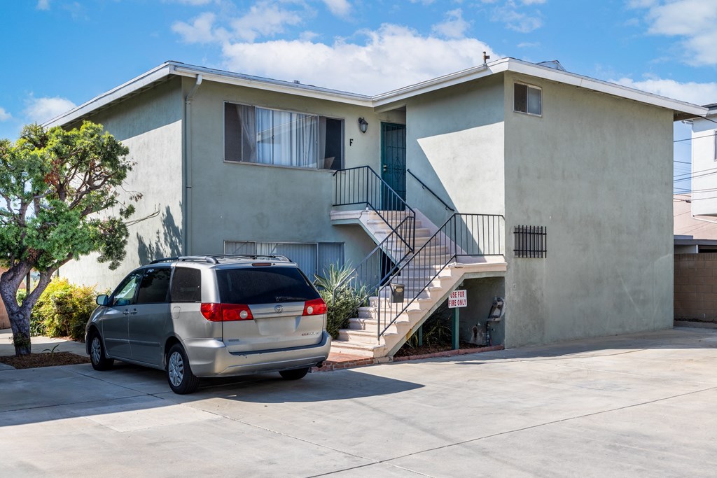 a house with a minivan parked in front of it