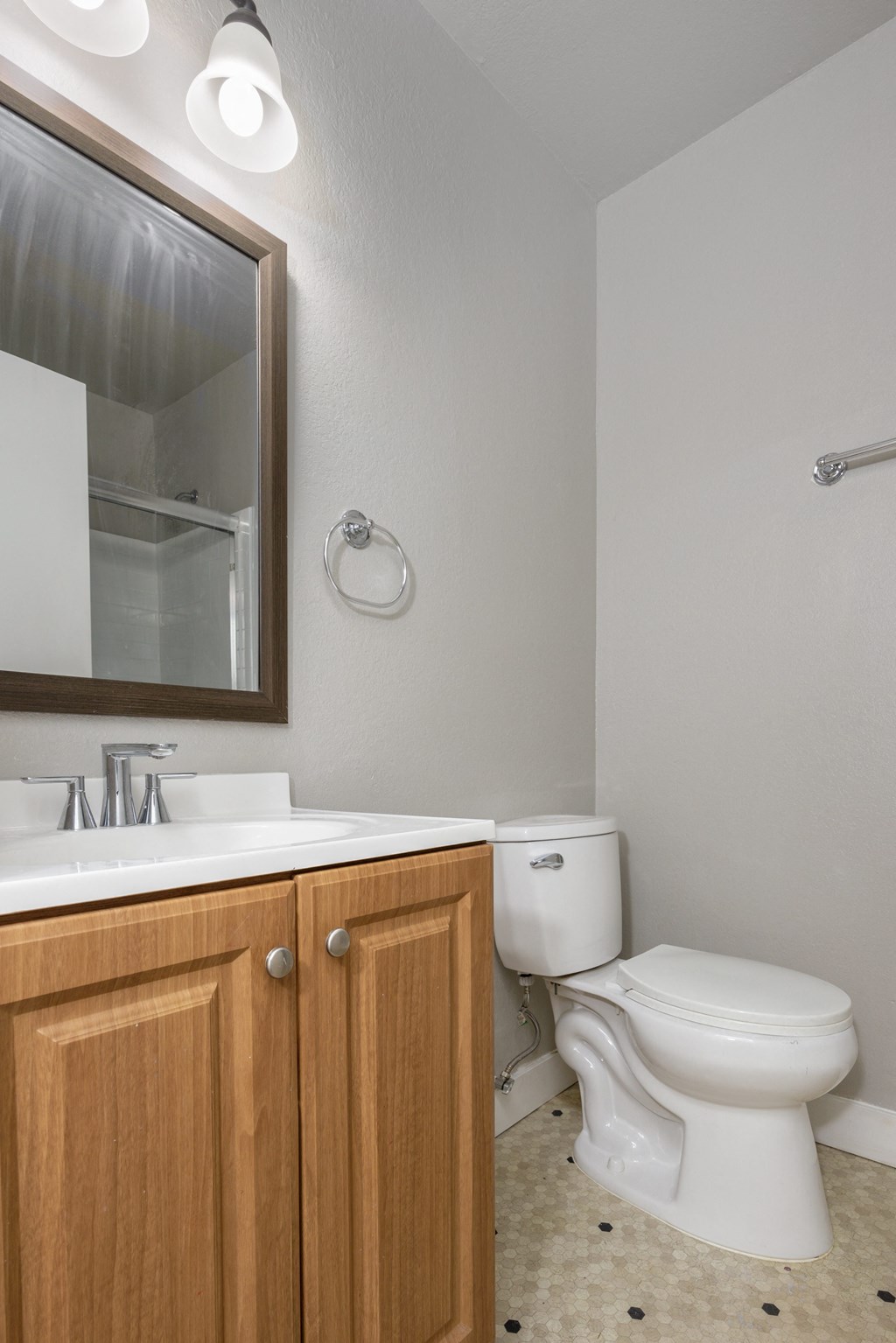 an empty bathroom with a toilet and a sink