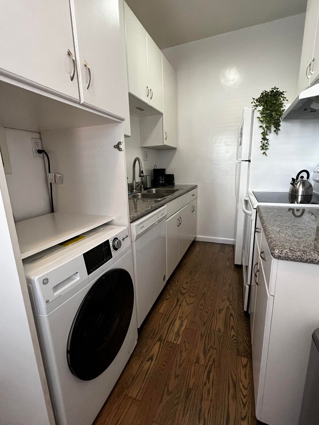 Kitchen with a washer and dryer in it