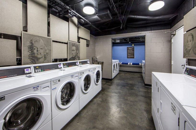 a laundromat with white washers and dryers