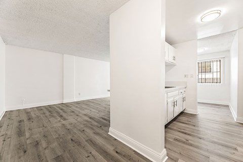 A room with wooden floors and white walls.
