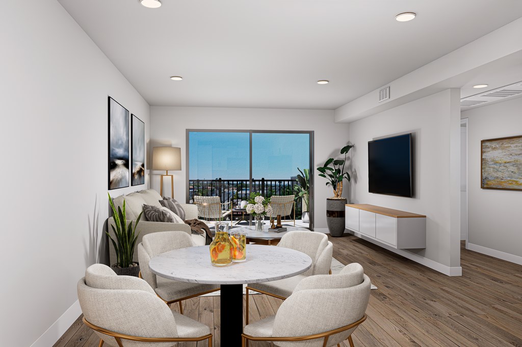 A modern dining room with a table set for four.