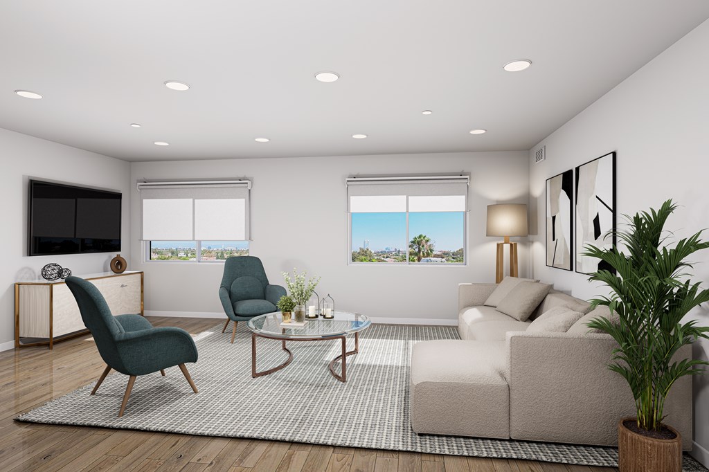 A modern living room with a green chair and a beige sofa.