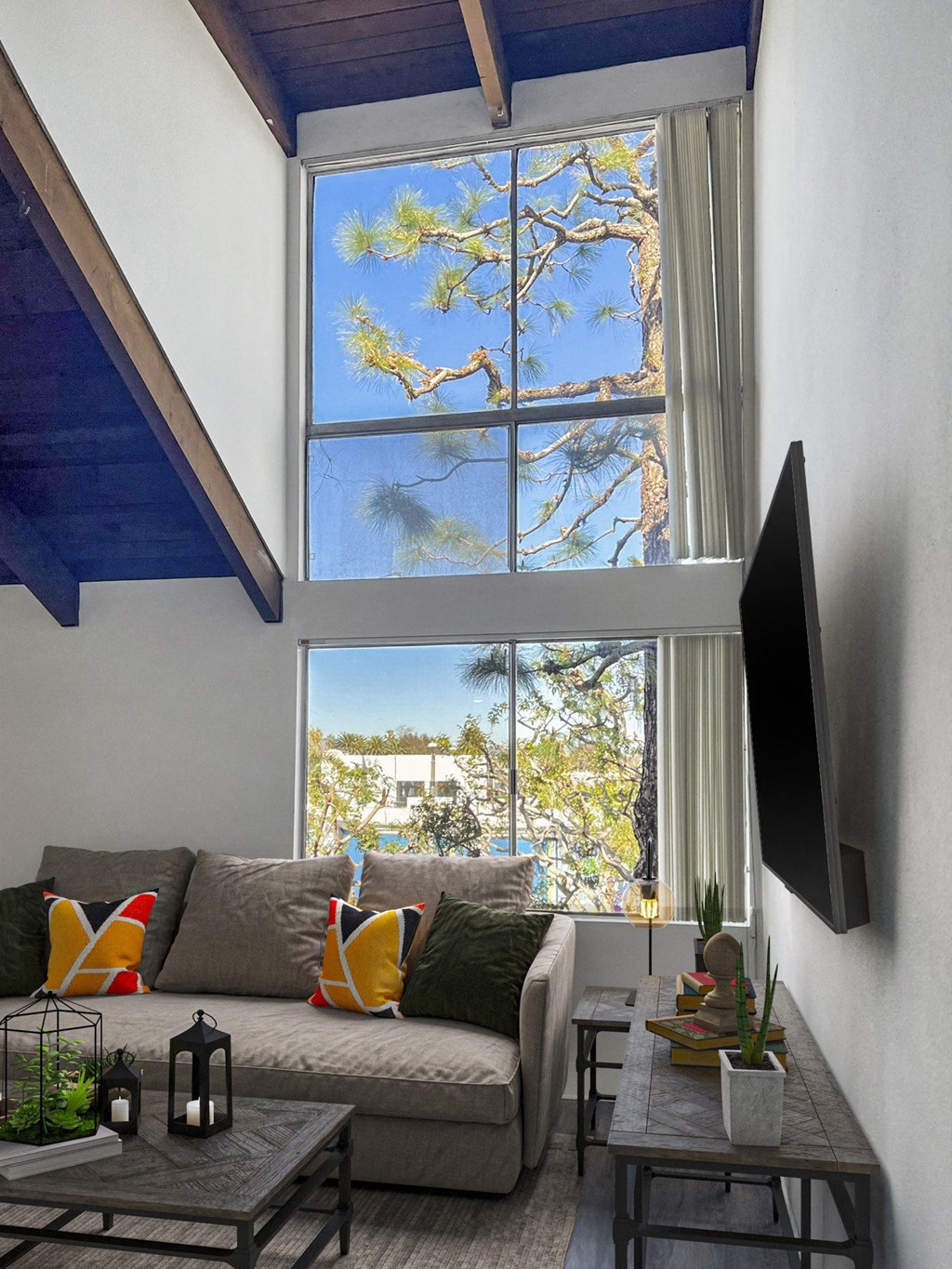 a living room with a couch and a large window