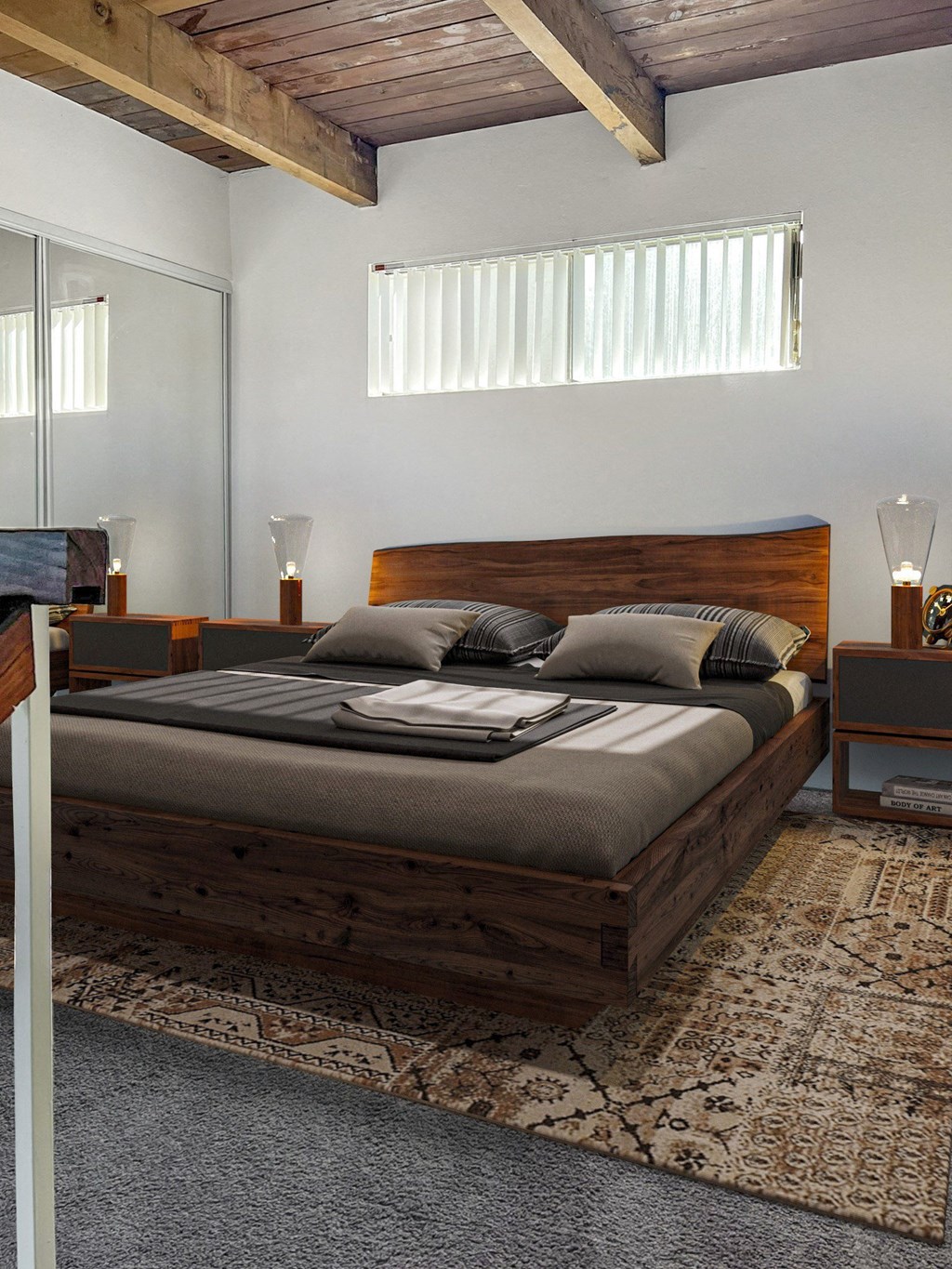 a bedroom with a bed and a rug