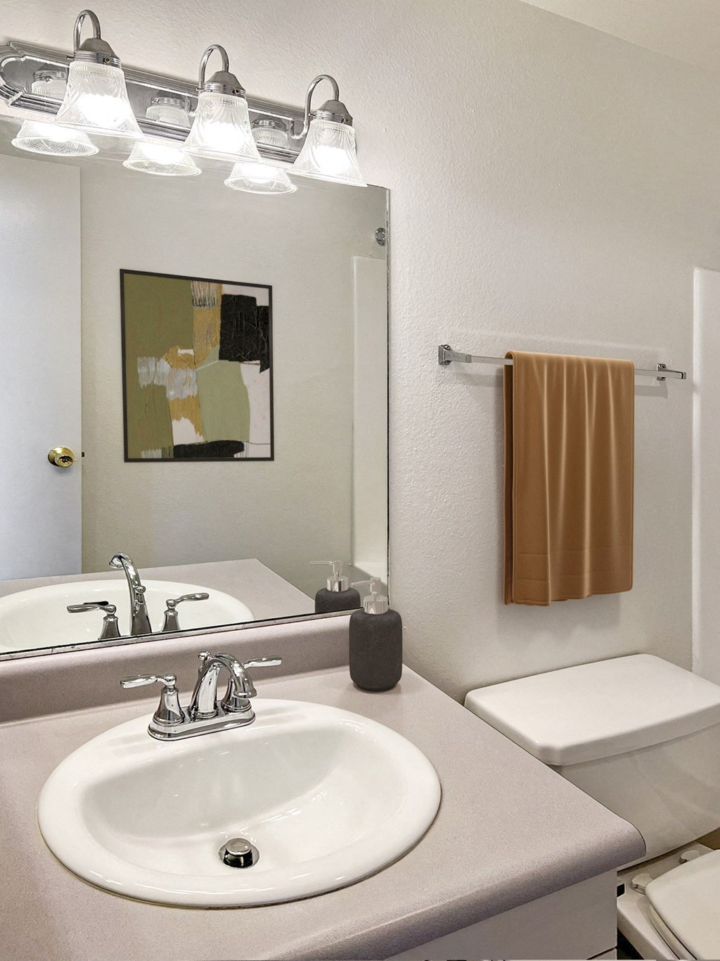 a bathroom with a sink and a mirror and a toilet