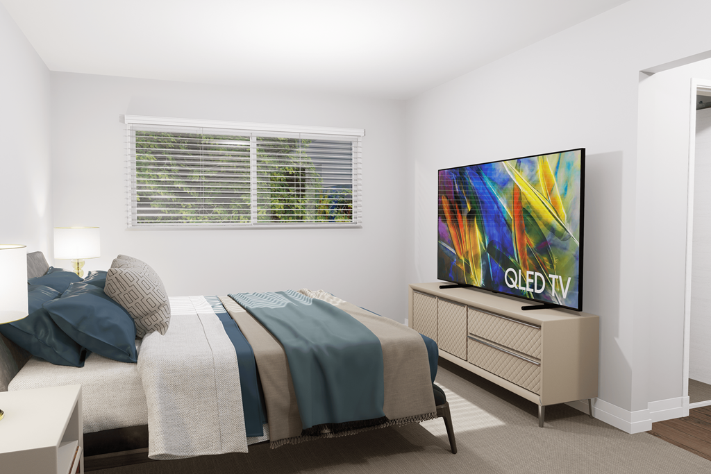 a bedroom with a bed and a tv in it