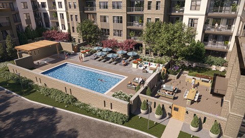 an aerial view of an apartment complex with a swimming pool