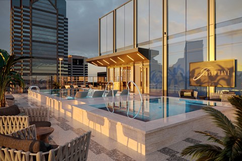 a swimming pool on the rooftop of a building with tall skyscrapers