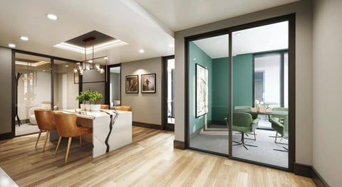 A modern dining room with a wooden table and chairs.