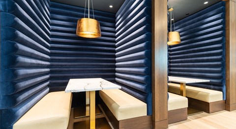 A dining area with a table and chairs.