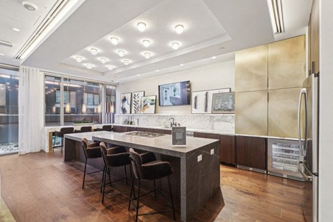 a large kitchen with a table and chairs