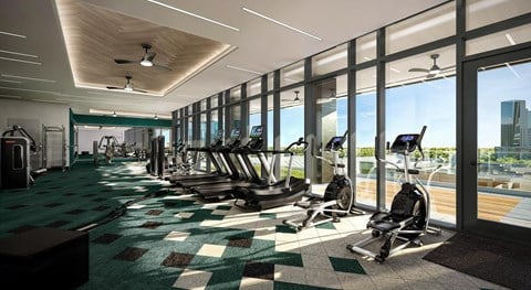 A gym with treadmills and exercise bikes.