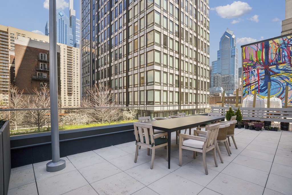 Outdoor dining room with summer kitchen and gas grills
