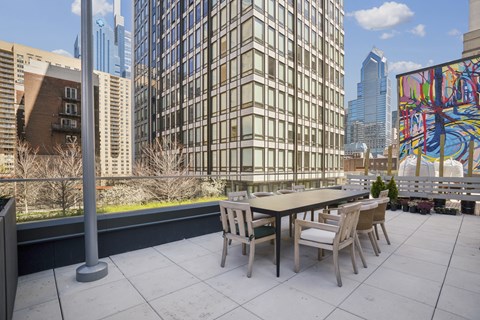 Outdoor dining room with summer kitchen and gas grills