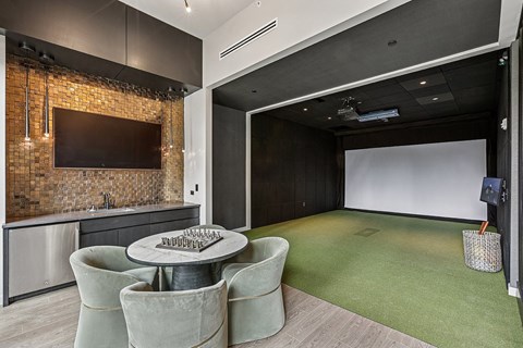 A modern kitchen with a dining table and chairs.