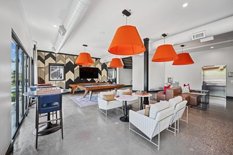 A modern living room with a dining table and chairs.