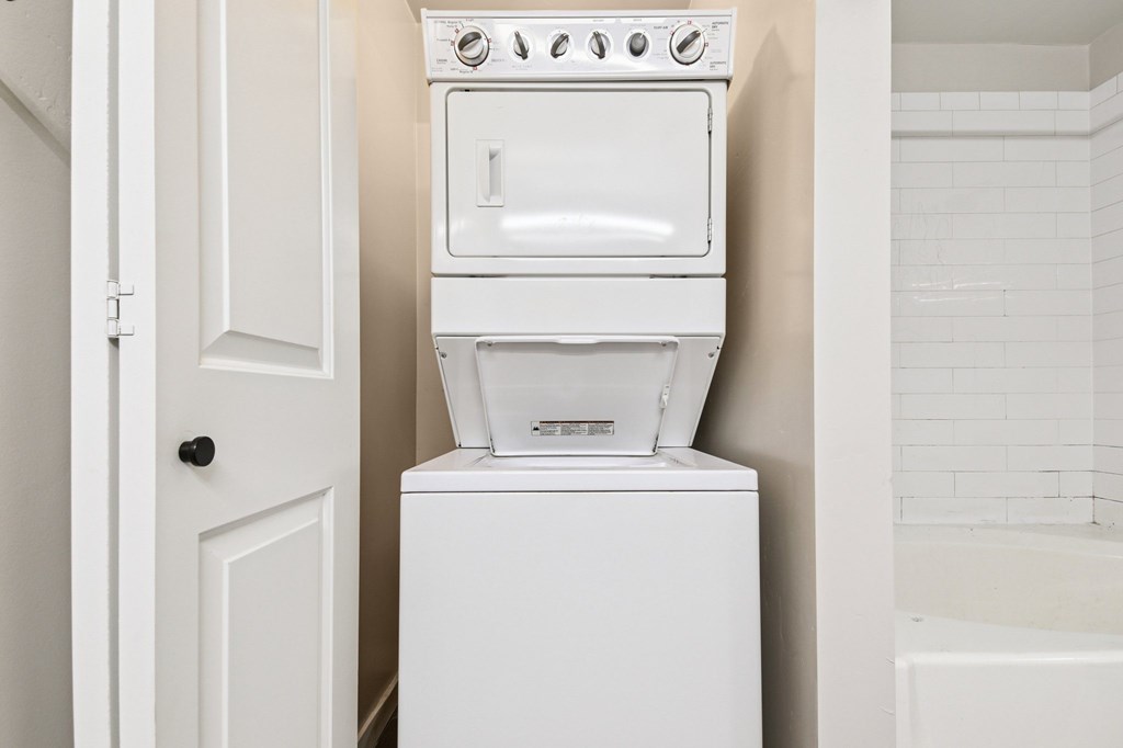 A white oven and dishwasher in a small kitchen.