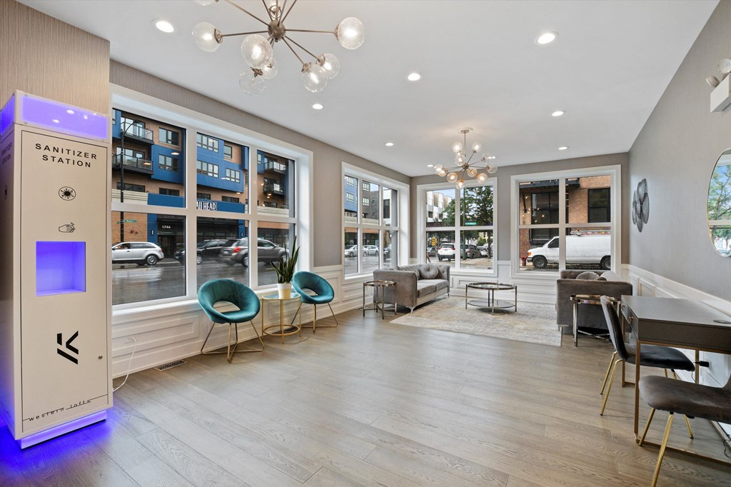 a common room with a vending machine and a view of the street