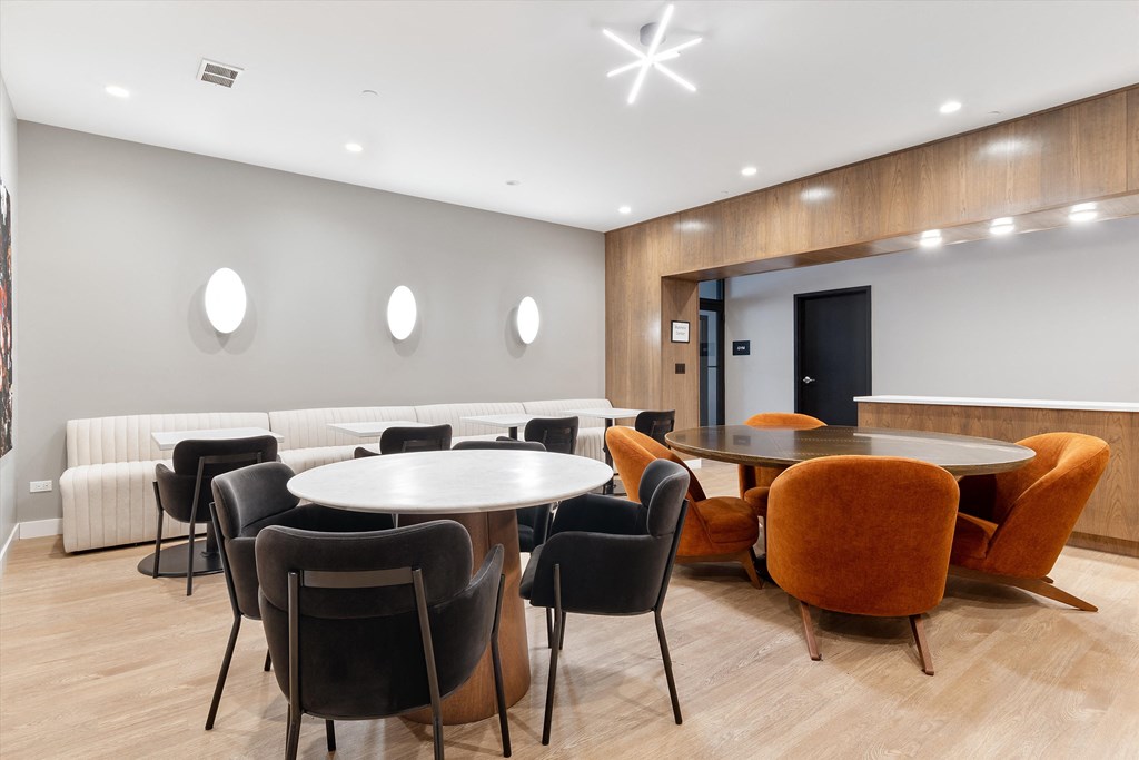 a room filled with furniture and a large window