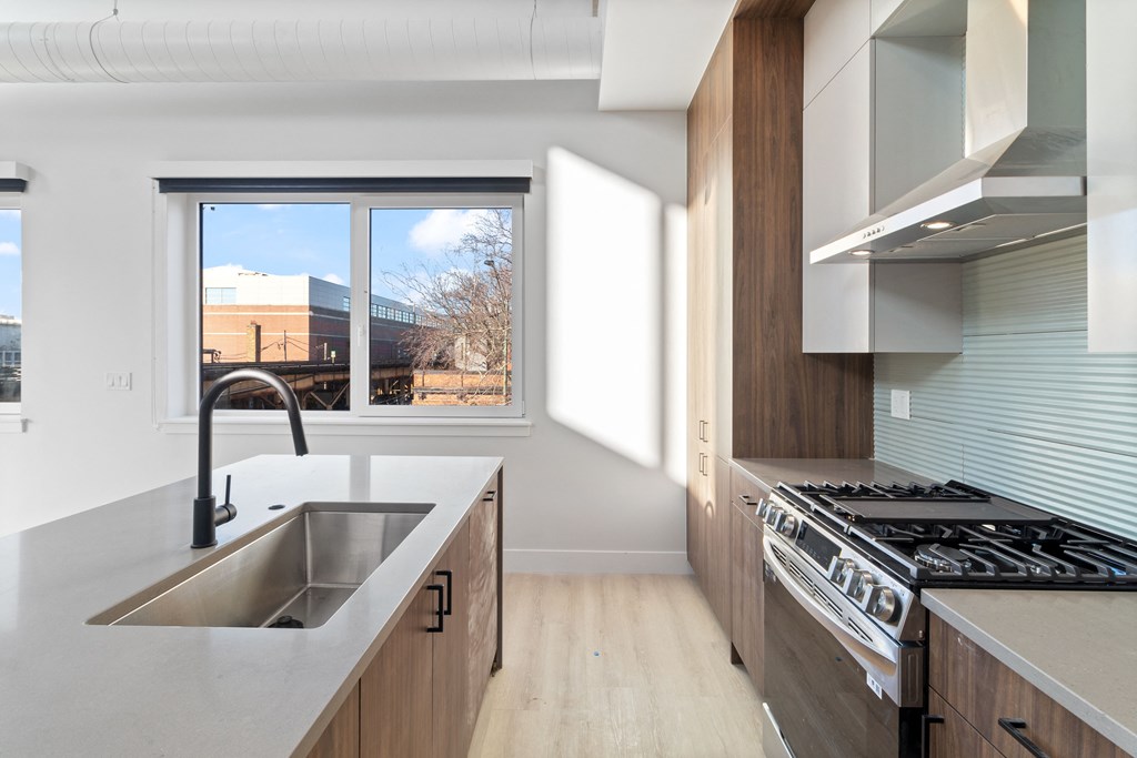 a kitchen with a sink and a window