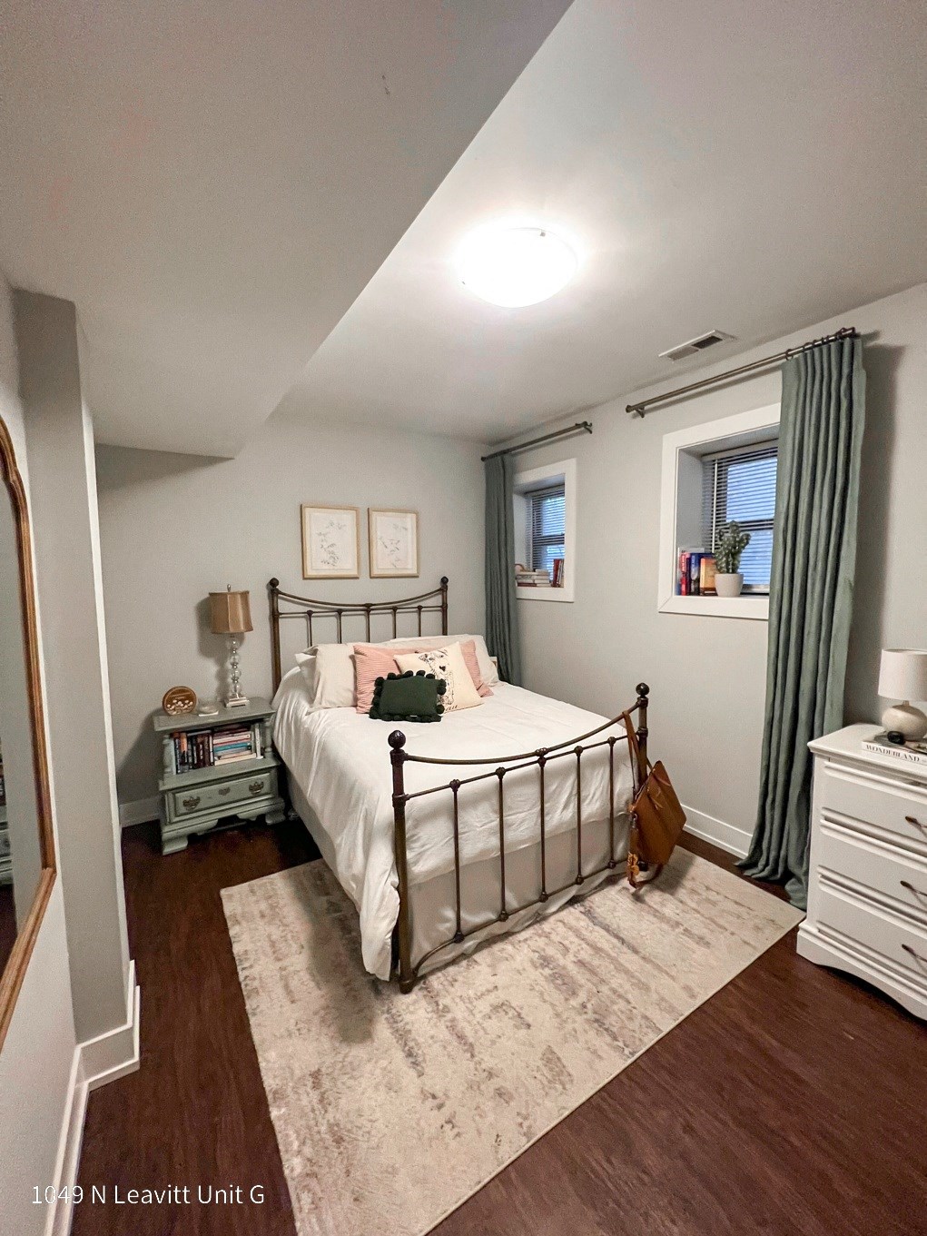 a bedroom with a bed and a nightstand