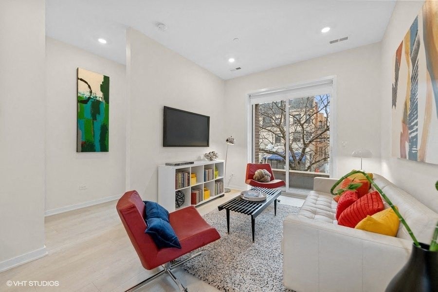 a living room with a couch and a tv