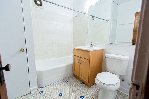 an empty bathroom with a toilet and a sink