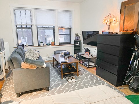 a living room with a couch and a tv