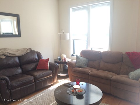 a living room with couches and a coffee table