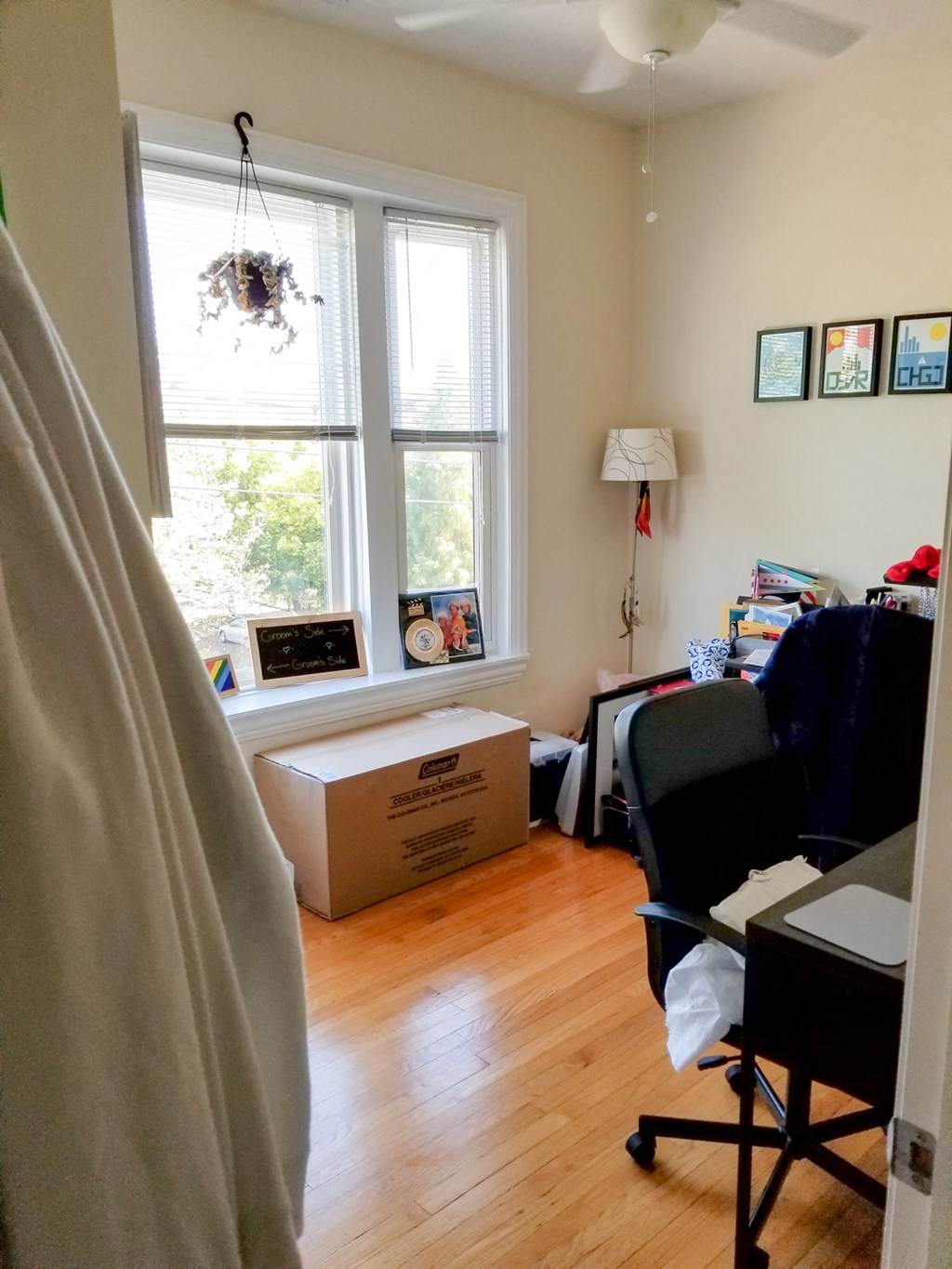 a room with a box on the floor and a window