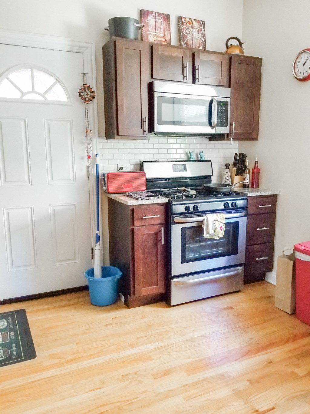 a kitchen with a stove and a microwave