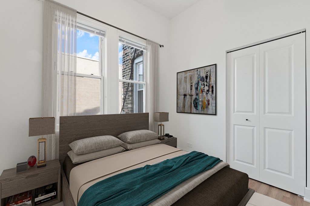 a bedroom with a bed and two windows