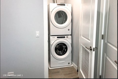 a washer and dryer are stacked on top of each other