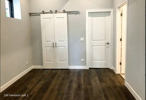 an empty room with two white doors