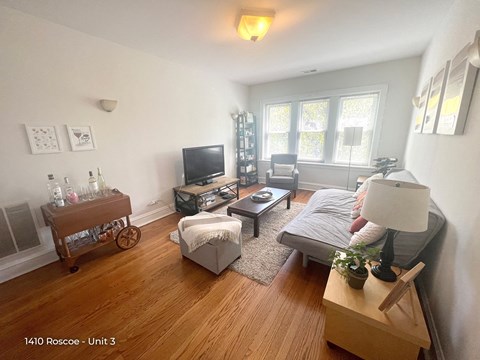 a living room with a couch and a tv