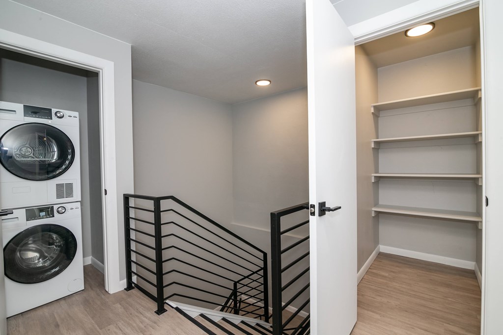 A laundry room with a washer and dryer in it.