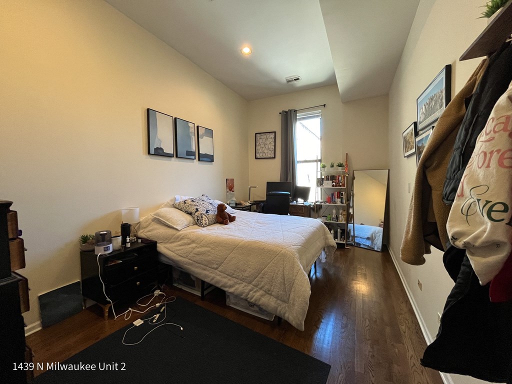 a bedroom with a bed and a closet