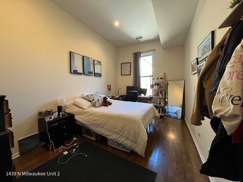 a bedroom with a bed and a closet