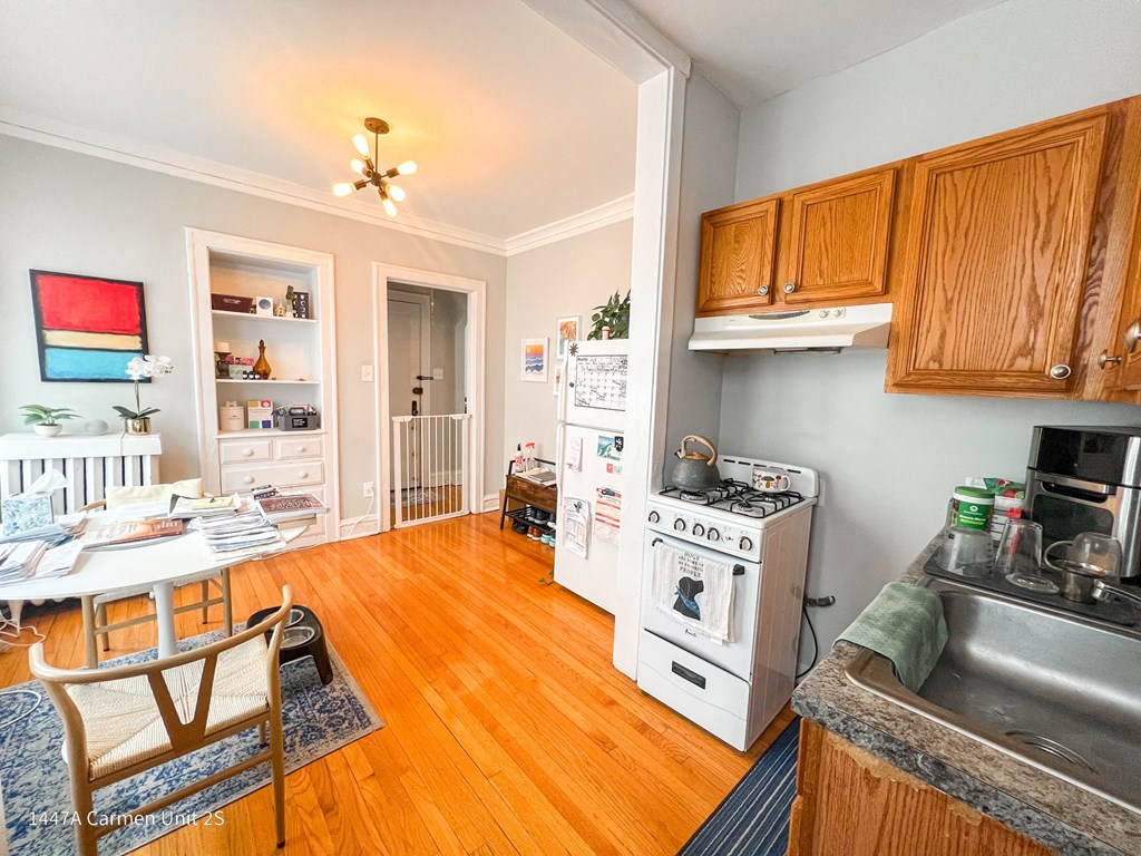 a living room with a kitchen and a dining room