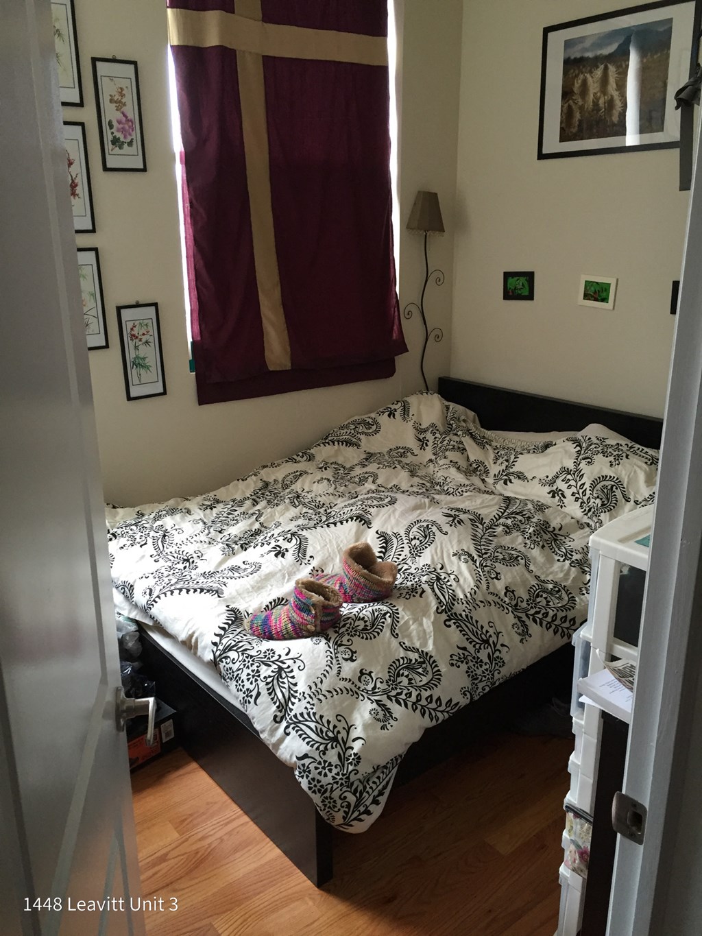 a little girl laying on a bed in a bedroom