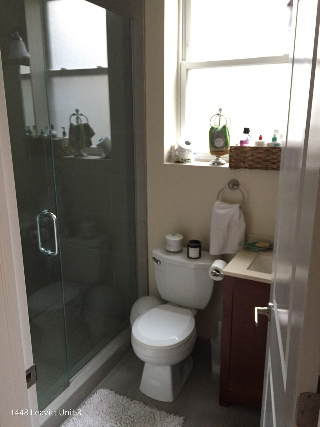 a small bathroom with a toilet and a shower