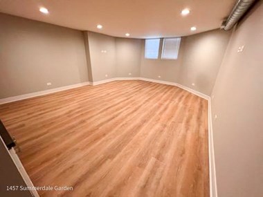 an empty room with a hard wood floor