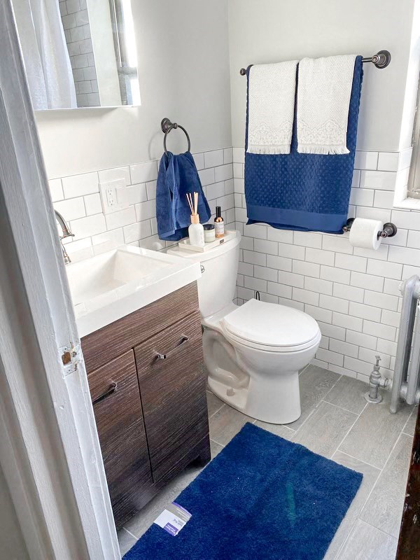 a bathroom with a white toilet and a sink
